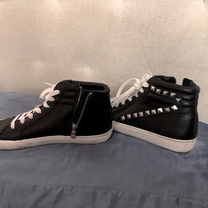 Black high top fashion sneakers with metal stud detailing